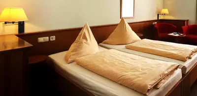 Ein Bett oder Betten in einem Zimmer der Unterkunft Landsitz Hotel Templin