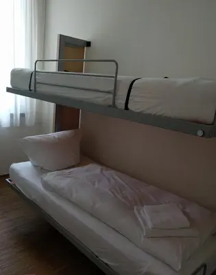 Ein Bett oder Betten in einem Zimmer der Unterkunft Seminarhaus S1516
