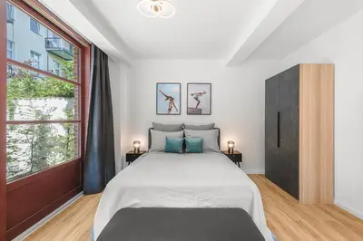 Ein Bett oder Betten in einem Zimmer der Unterkunft Mitte Loft group & family friendly, 150m2, 2BRs, 2Bathrooms, living & dinning room , 4 - 8 Guests