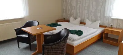 Ein Bett oder Betten in einem Zimmer der Unterkunft Pension Am Rheinsberger Schloßpark