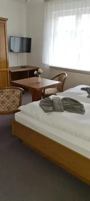 Ein Bett oder Betten in einem Zimmer der Unterkunft Pension Am Rheinsberger Schloßpark
