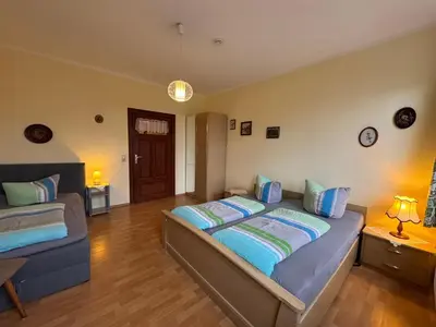 Ein Bett oder Betten in einem Zimmer der Unterkunft Pension Märkische Bauernstube