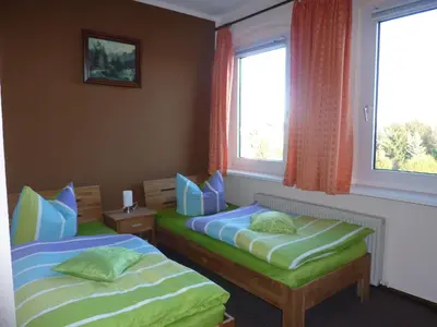 Ein Bett oder Betten in einem Zimmer der Unterkunft Pension Märkische Bauernstube