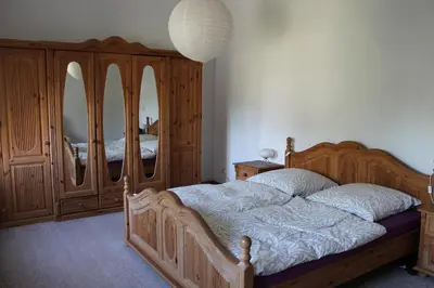 Ein Bett oder Betten in einem Zimmer der Unterkunft Ferienwohnungen Heiliger See Potsdam