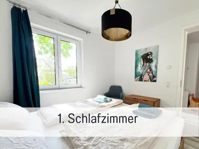 Ein Bett oder Betten in einem Zimmer der Unterkunft Familienfreundliches Apartment zwischen Potsdam und Berlin für 2-4 Personen - Parkplatz - Balkon - Voll ausgestattete Küche - WLAN - Ferienwohnung Nebelwiesen Stahnsdorf