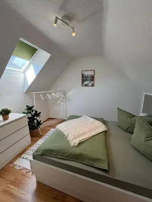 Ein Bett oder Betten in einem Zimmer der Unterkunft Ferienwohnung Rheinsberg in Schlossnähe