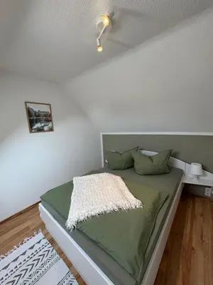 Ein Bett oder Betten in einem Zimmer der Unterkunft Ferienwohnung Rheinsberg in Schlossnähe