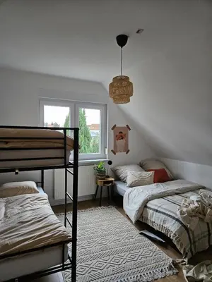 Ein Bett oder Betten in einem Zimmer der Unterkunft Cozy house and free parking
