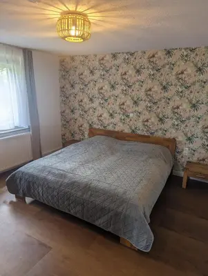 Ein Bett oder Betten in einem Zimmer der Unterkunft idyllische Lage direkt am See
