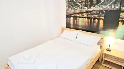 Ein Bett oder Betten in einem Zimmer der Unterkunft Green Apartment KM1 Small two-room apartment with terrace