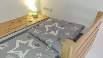 Ein Bett oder Betten in einem Zimmer der Unterkunft Green Apartment KM1 Small two-room apartment with terrace
