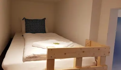Ein Bett oder Betten in einem Zimmer der Unterkunft Green Apartment Studio L29 Neukölln