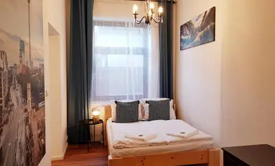 Ein Bett oder Betten in einem Zimmer der Unterkunft Green Apartment Studio L29 Neukölln