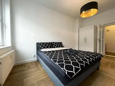 Ein Bett oder Betten in einem Zimmer der Unterkunft HolidayHome Apartments I Spacious 67sqm in Berlin Friedrichshain