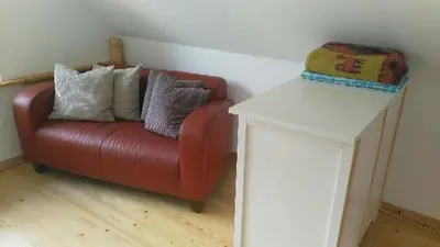 Ein Sitzbereich in der Unterkunft Schwalbenhaus-Netzow