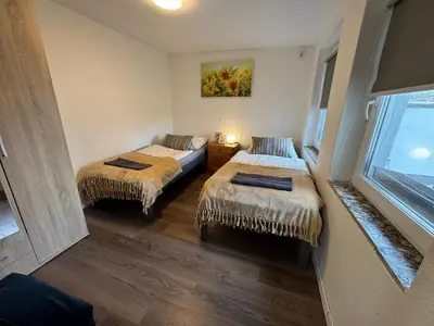 Ein Bett oder Betten in einem Zimmer der Unterkunft Wohnung mit Garten und Terrasse für 7 Personen