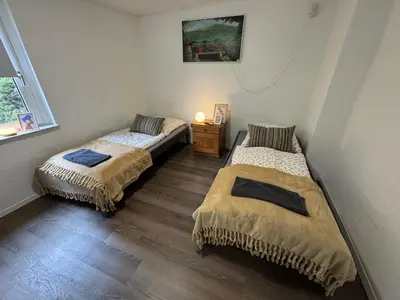 Ein Bett oder Betten in einem Zimmer der Unterkunft Wohnung mit Garten und Terrasse für 7 Personen