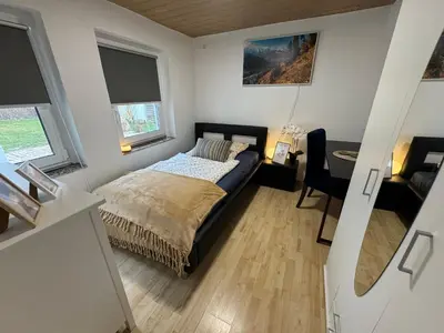 Ein Bett oder Betten in einem Zimmer der Unterkunft Wohnung mit Garten und Terrasse für 7 Personen