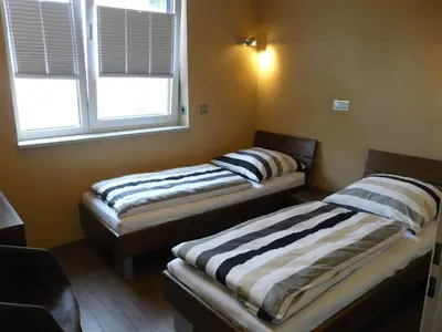 Ein Bett oder Betten in einem Zimmer der Unterkunft Luxus-Ferienhaus direkt am See, naturnaher Komfort in modernem Stil