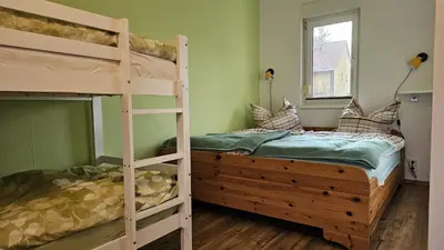 Ein Bett oder Betten in einem Zimmer der Unterkunft Ferienbungalow Kräuterhexxe
