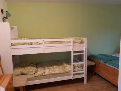 Ein Bett oder Betten in einem Zimmer der Unterkunft Ferienbungalow Kräuterhexxe