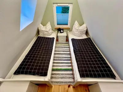 Ein Bett oder Betten in einem Zimmer der Unterkunft Finnhütte Marie am Storkower See