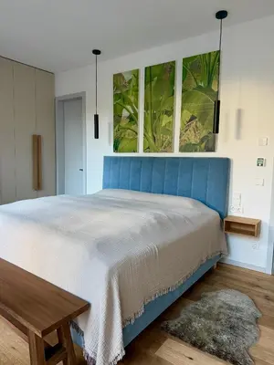 Ein Bett oder Betten in einem Zimmer der Unterkunft Bad Seerose mit Seeblick, Dachterrasse, Pool und Sauna