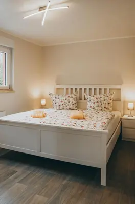 Ein Bett oder Betten in einem Zimmer der Unterkunft Ferienhaus in See nähe
