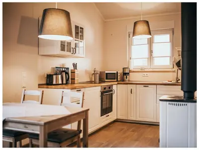 Küche/Küchenzeile in der Unterkunft Ferienhaus in See nähe