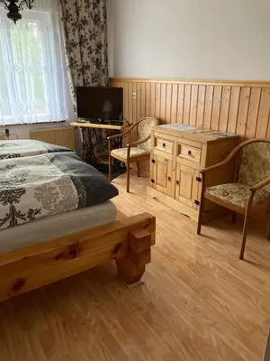 Ein Bett oder Betten in einem Zimmer der Unterkunft Ferienwohnung am Waldesrand