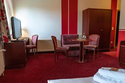 Ein Sitzbereich in der Unterkunft Parkhotel Neustadt Garni
