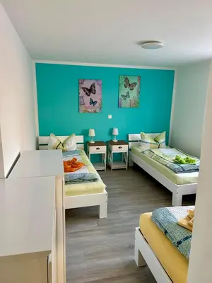 Ein Bett oder Betten in einem Zimmer der Unterkunft Goldener Anker, verschiedene gemütliche Ferienwohnungen