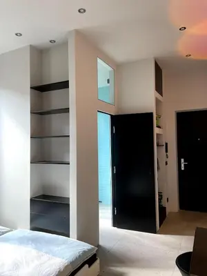 Ein Bett oder Betten in einem Zimmer der Unterkunft Room with a bathroom and private entrance door