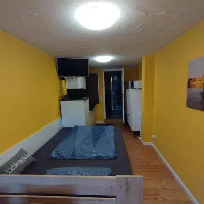 Ein Bett oder Betten in einem Zimmer der Unterkunft Ferienzimmer am Atelier