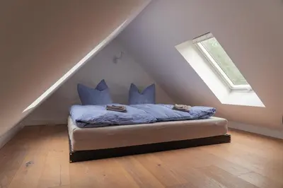 Ein Bett oder Betten in einem Zimmer der Unterkunft Wald- und Seeidyll im historischen Forsthaus