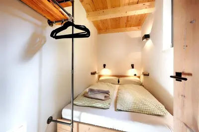 Ein Bett oder Betten in einem Zimmer der Unterkunft Refugium im Wald