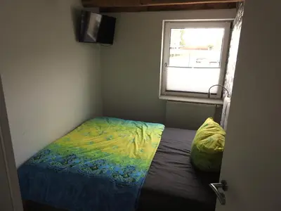 Ein Bett oder Betten in einem Zimmer der Unterkunft alte Magd