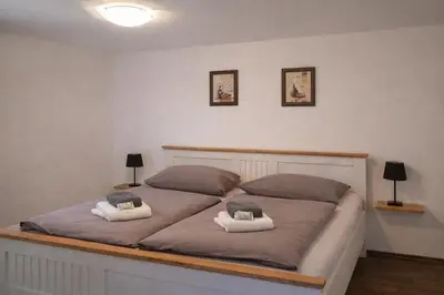 Ein Bett oder Betten in einem Zimmer der Unterkunft Ferienhaus Ludwig Leichhardt