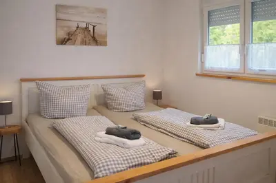 Ein Bett oder Betten in einem Zimmer der Unterkunft Ferienhaus Friedland
