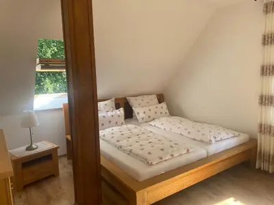 Ein Bett oder Betten in einem Zimmer der Unterkunft Pension zm Zenshaus FW Balance