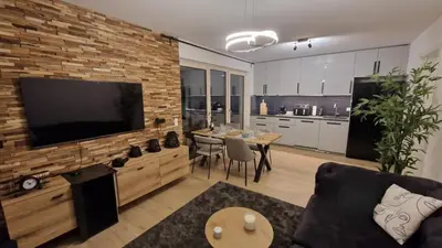 TV/Unterhaltungsangebot in der Unterkunft Apartment Grey am See mit Zugang