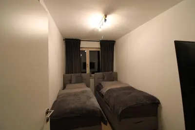 Ein Bett oder Betten in einem Zimmer der Unterkunft Apartment Grey am See mit Zugang