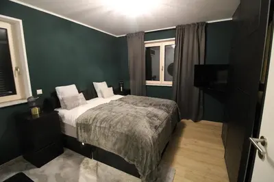 Ein Bett oder Betten in einem Zimmer der Unterkunft Apartment Grey am See mit Zugang