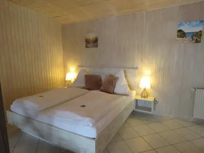 Ein Bett oder Betten in einem Zimmer der Unterkunft Haus Evelyn