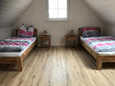 Ein Bett oder Betten in einem Zimmer der Unterkunft Ferienhaus im Hafendorf