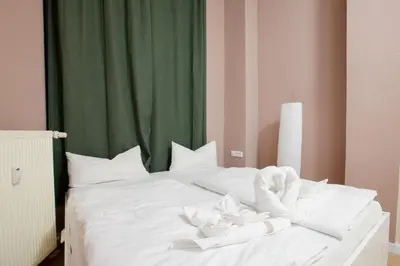 Ein Bett oder Betten in einem Zimmer der Unterkunft Atelier Rosé