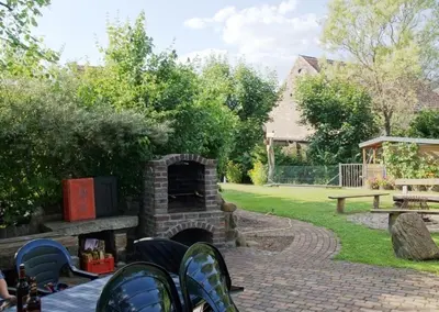 Ein Garten an der Unterkunft Haus H&M Ferienwohnung 4
