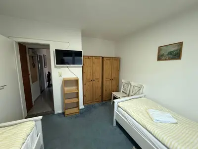 Ein Bett oder Betten in einem Zimmer der Unterkunft Gästehaus mit Garten