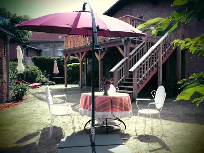 Ein Garten an der Unterkunft SchlossparkFerienwohnungen Rheinsberg mit Garten