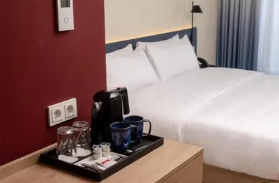 Ein Bett oder Betten in einem Zimmer der Unterkunft Hampton By Hilton Potsdam Babelsberg